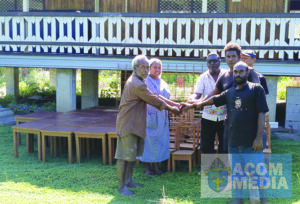 Br. Samson and Sister Neslyn receiving the chairs and tables from the builders